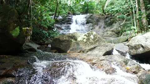 Clear cold waterfall flow into rock Video stock 95650711