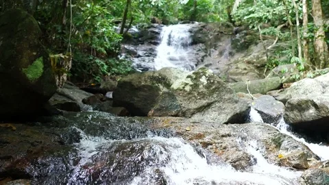 Clear cold waterfall flow into rock Video stock 95651211
