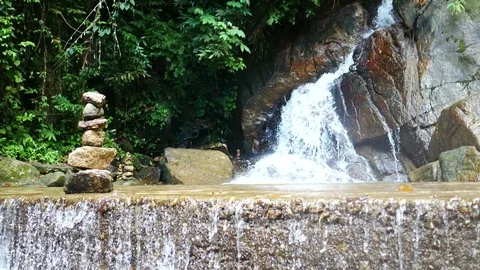 Clear cold  waterfall flow into rock ,  stone sort Stock Footage 95651752