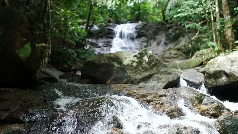 Clear cold waterfall flow into rock Video stock 95653796
