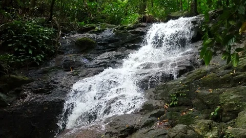 Clear cold waterfall flow into rock Video stock 95654270