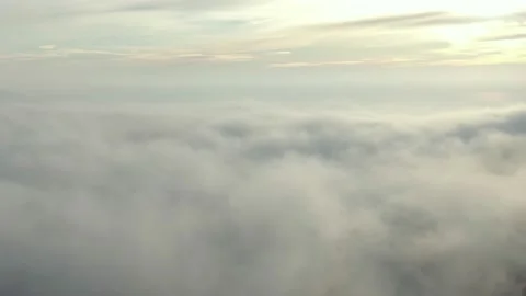 Clear composition from skies above and clouds at the bottom. Camera flight away Stock Footage 147430522