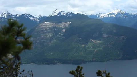 Clear Cut Mountain Side From Across The Water Stock Footage 99940422