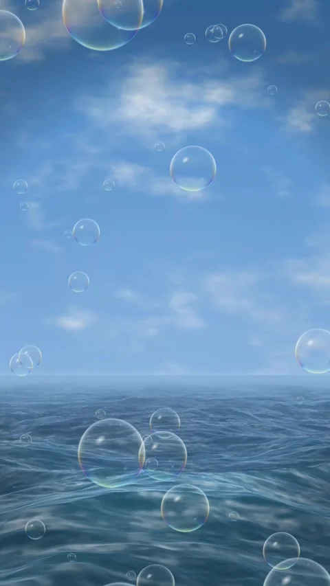 Clear Day Sky Loop with Soap Bubbles Floating Over Ocean Water 스톡 동영상 346270647