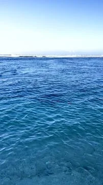 Clear Deep Blue Ocean Water with Distant Waves in Bali Stock Photos