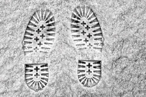 Clear deep footprints on white winter snow Stock Photos