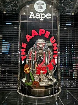 Clear display features a metallic gorilla sculpture with "Aape Universe" Stock Photos