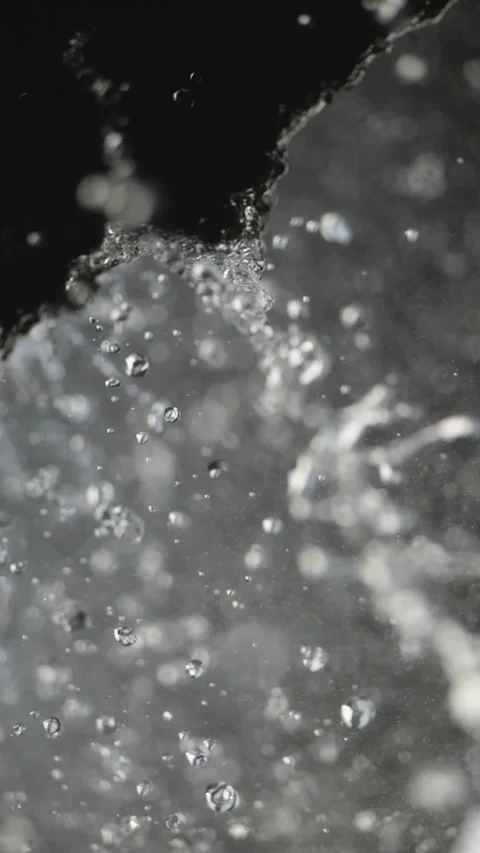 Clear droplets fall from rocks in slow motion, each one highlighted. A wate.. Stock Footage 295954214