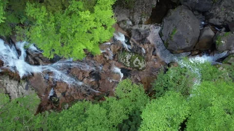 Clear Emerald River from a Waterfall Aerial Drone Footage in Fresh Green Season Video stock 335762172