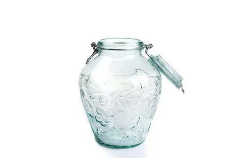 The clear empty jar with a lid on a white Stock Photos