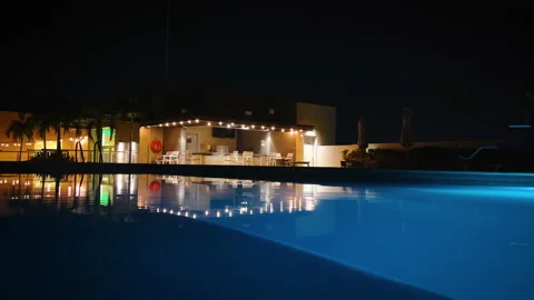 Clear evening pool at night with gentle ripples Stock Footage 212133655