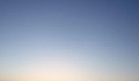 Clear evening sky without clouds. Sky background or gradient. Stock Photos