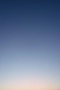 Clear evening sky without clouds. Sky background or gradient. Stock Photos