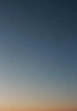 Clear evening sky without clouds. Sky as background or gradient. ISO 100, not Stock Photos