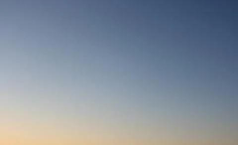 Clear evening sky without clouds. Sky background or gradient. ISO 100, not ph Stock Photos