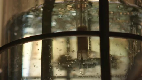 Clear fluid with bubbles is beeing mixed in medical laboratory, pharmacy concept Stock Footage 153475653