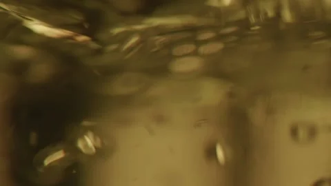 Clear fluid with bubbles is beeing mixed in medical laboratory, pharmacy concept Stock Footage 153475708