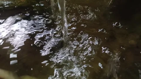 Clear, fresh water flows into the close-up column. Stock Footage 334829745