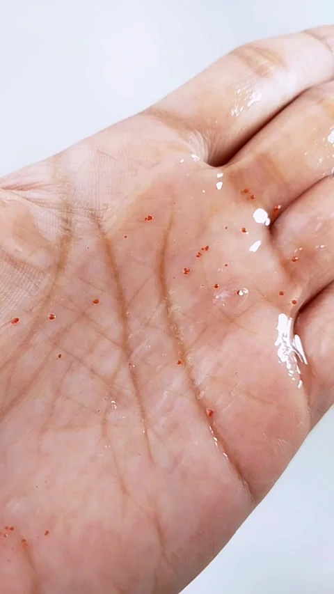 Clear gel with raspberry extract on palm skin. Refreshing skincare texture,.. Stockbeeldmateriaal 346584543