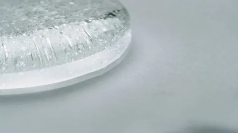 Clear Gel With Tiny Bubbles Flowing And Moving Smoothly On A White Stock Footage 138410912