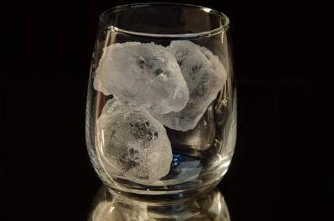 Clear Glass with Ice Cubes for Refreshment Stock Photos