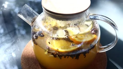 A clear glass pitcher filled with refreshing lemon slices and water, perfec.. Stock Footage 342430990