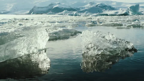 Clear ice chunks floating in a glacier lagoon in Iceland Stock-Footage 348026057