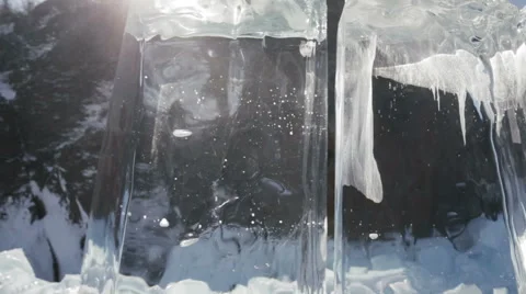 Clear ice cube motion mountain background Stock Footage 57763551
