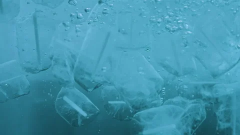 Clear Ice Cubes Falling into Water Stock Footage 170794630