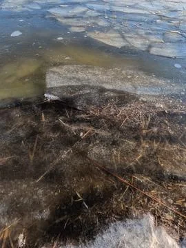 Clear ice on the river. ice texture. the ice is melting. spring thaw. froze.. Stockfoto's