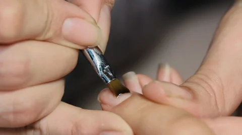 Clear lacquer applied to the fingernails Stock Footage 64570163