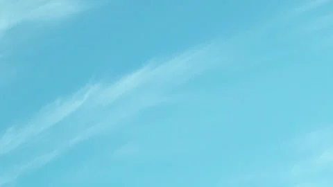 Clear Light Blue Sky and Feathery White Clouds. Sunny Pure Azure Skyscraper with Stock Footage 268251394