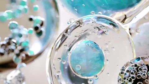 Clear liquid bubbles slowly moving and rotating macro close up motion. Video stock 342420618