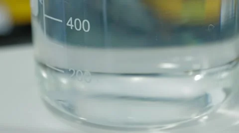 Clear Liquid Is Mixed In A Glass Flask Stock Footage 61458131