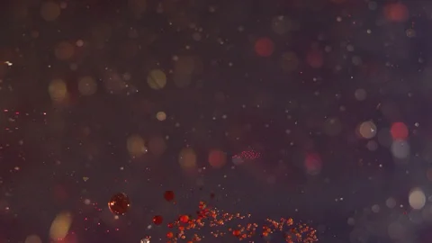 Clear liquid splash on a dark bokeh background texture Video stock 118288054