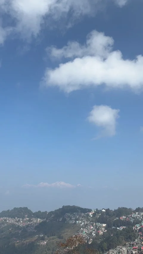 Clear midday view of Mount Kanchenjunga snow peaks under a bright blue sky .. Stock Footage 334171033