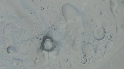 Clear Mixture with Bubbles Spins Stock Footage 77780615