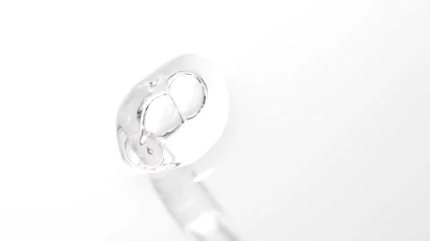 Clear moisturizer drop of essence,  serum or gel falls from a pipette, macr.. Vídeos de archivo 305074100