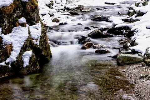 Clear mountain river during a winter day Stock Photos