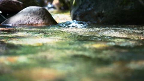 Clear Mountain Stream Flowing Between Natural Rocks Stock Photos