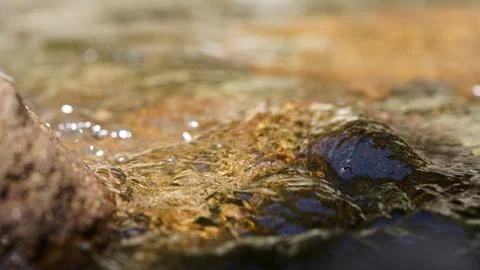 Clear Mountain Stream Flowing Between Natural Rocks Stock Photos