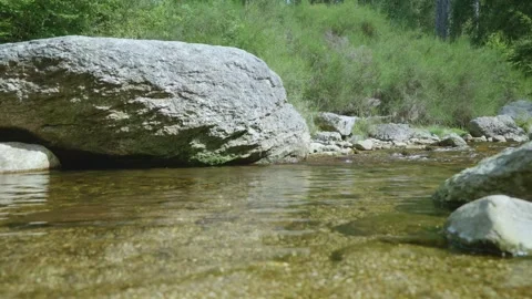 Clear Mountain Stream with Large Boulder Video stock 330749637