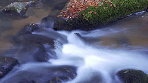 Clear Mountain Stream Running Down Through Mossy Boulders Stock Footage 144057036