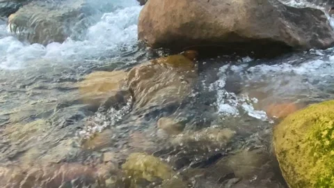Clear mountain stream water flowing over rocks Stock Footage 345667310