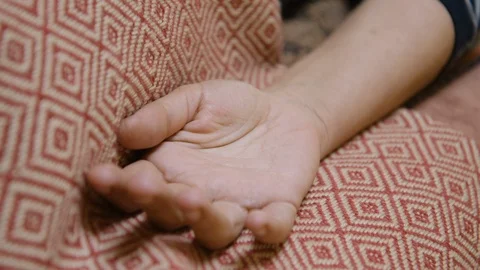 A clear obsidian crystal is placed into a hand during crystal healing Stock Footage 122089039