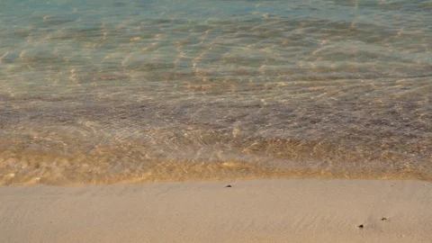 Clear ocean waves lapping on sandy beach Stock Footage 94105898
