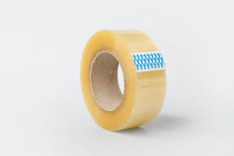 Clear packaging tape roll with blue arrows on white background, shipping and  Stock Photos