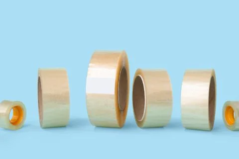 Clear packaging tape rolls in various sizes for shipping and moving, isolated Stock Photos
