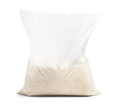 Clear plastic bag filled with raw white rice grains, long grain basmati or .. Stock Photos