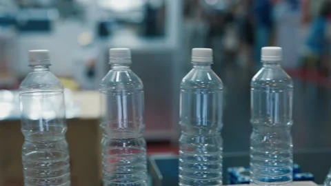 Clear Plastic Bottles on Assembly Line Stock Footage 276979305